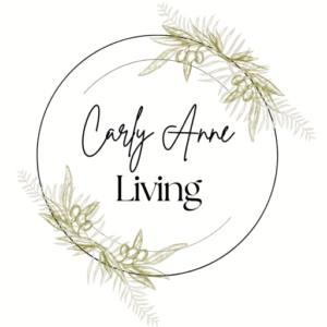 Carly Anne Living logo with soft green olive branches and elegant script text — Carly Anne Living brand logo – wholesome home inspired by faith.