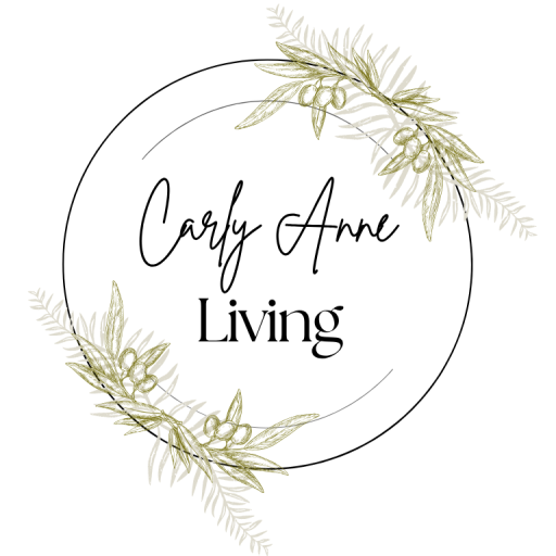 Carly Anne Living logo with soft green olive branches and elegant script text — representing faith, simplicity, and intentional living.